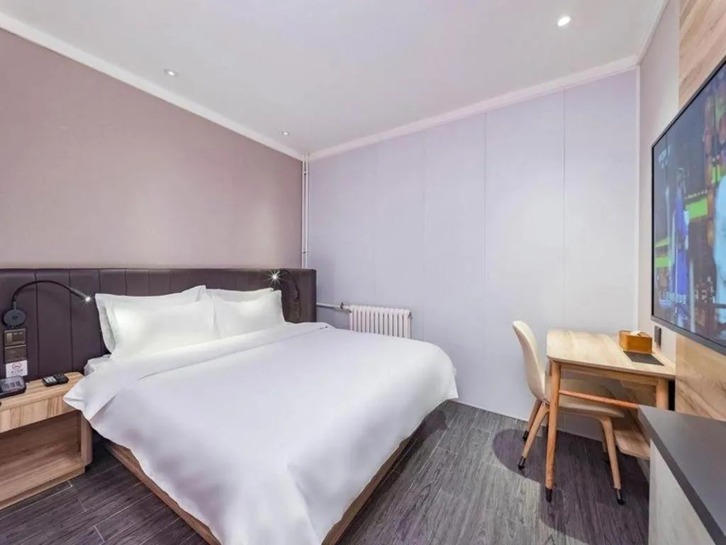 Bed in Hanting Premium Hotel Beijing Wudaokou East Gate of Tsinghua