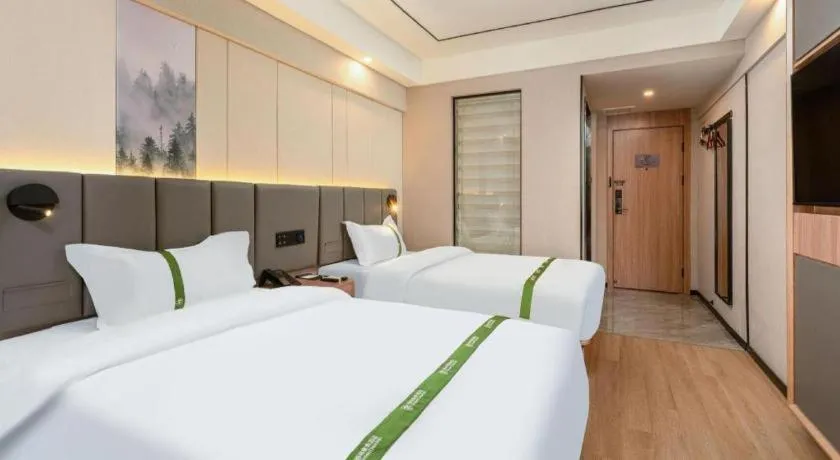 Bed in GreenTree Inn Jinan Quancheng Hotel