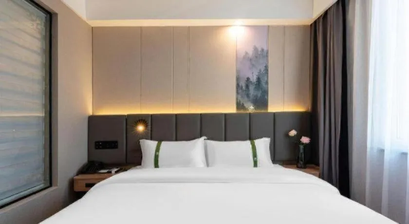 Bed in GreenTree Inn Jinan Quancheng Hotel