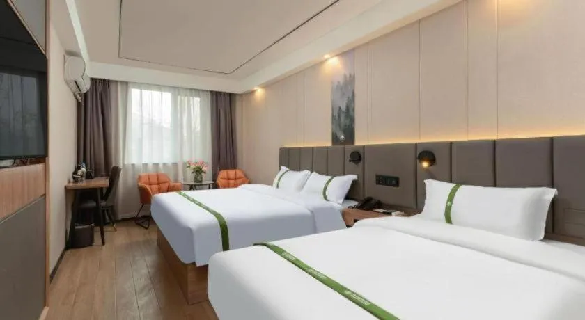 Bed in GreenTree Inn Jinan Quancheng Hotel