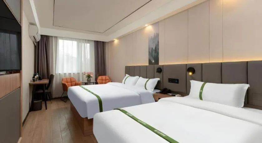 Bed in GreenTree Inn Jinan Quancheng Hotel