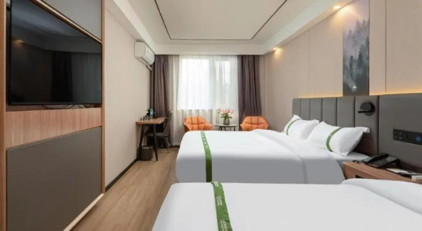 Bed in GreenTree Inn Jinan Quancheng Hotel