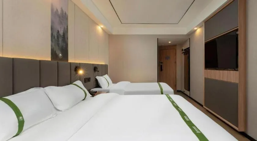 Bed in GreenTree Inn Jinan Quancheng Hotel