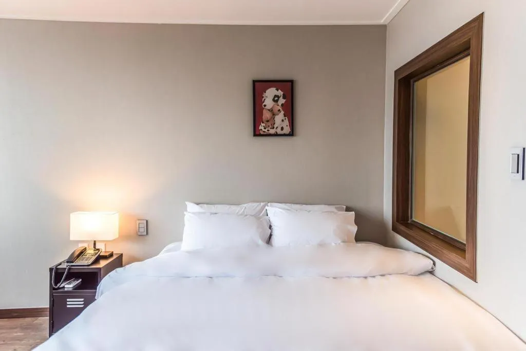 Bed in Check Inn Hotel