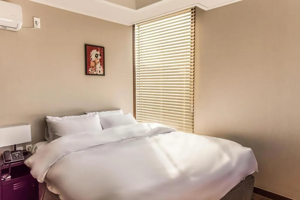 Bed in Check Inn Hotel