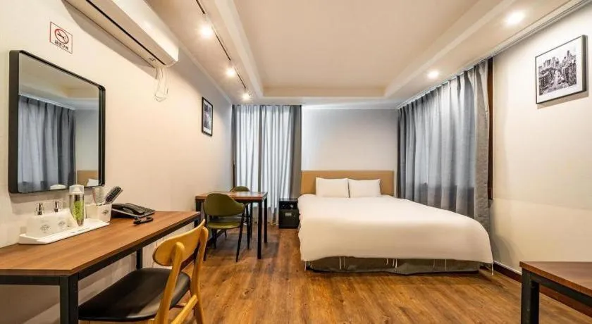 Bed in Check Inn Hotel