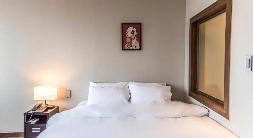 Bed in Check Inn Hotel