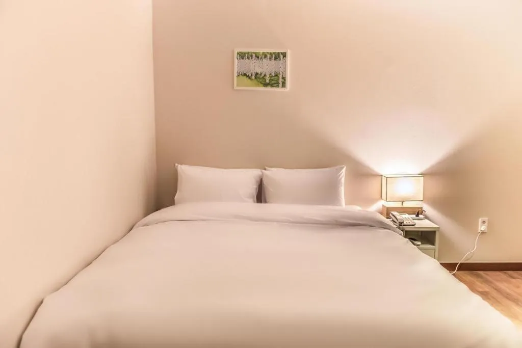 Bed in Check Inn Hotel