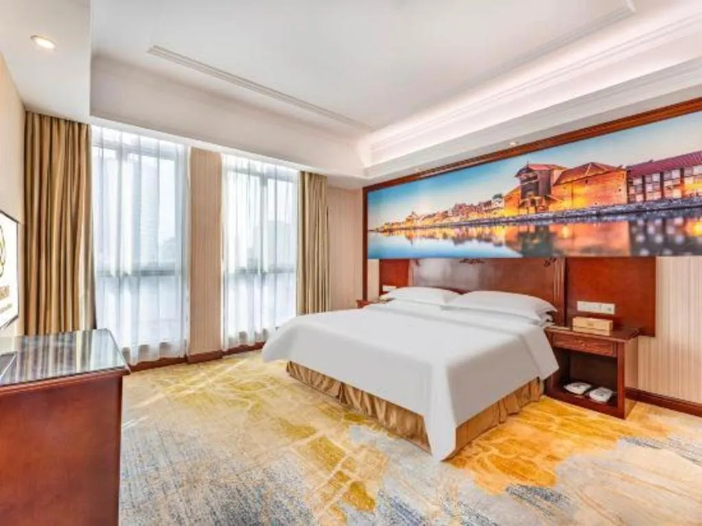 Bed in Vienna International Hotel Guangzhou Tianhe Olympic Stadium Dongpu