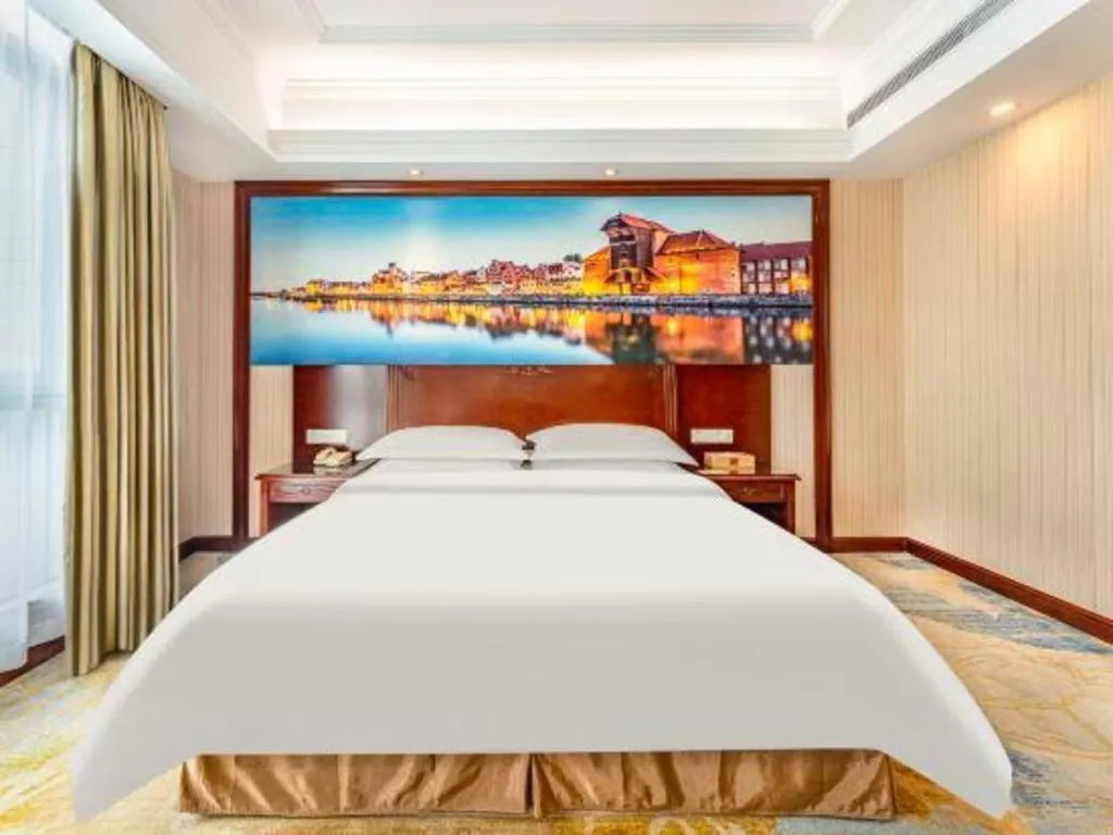 Bed in Vienna International Hotel Guangzhou Tianhe Olympic Stadium Dongpu