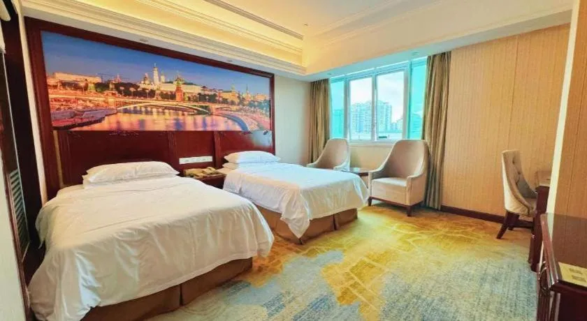 Bed in Vienna International Hotel Guangzhou Tianhe Olympic Stadium Dongpu