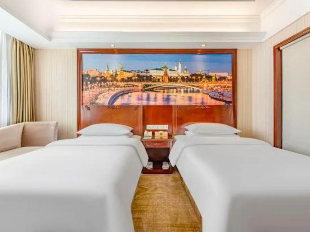 Bed in Vienna International Hotel Guangzhou Tianhe Olympic Stadium Dongpu