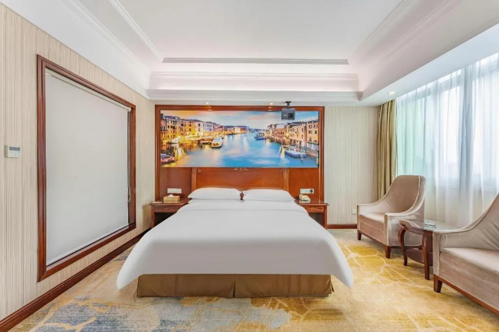 Bed in Vienna International Hotel Guangzhou Tianhe Olympic Stadium Dongpu