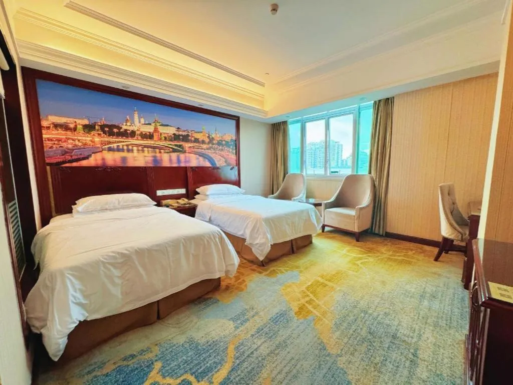 Bed in Vienna International Hotel Guangzhou Tianhe Olympic Stadium Dongpu