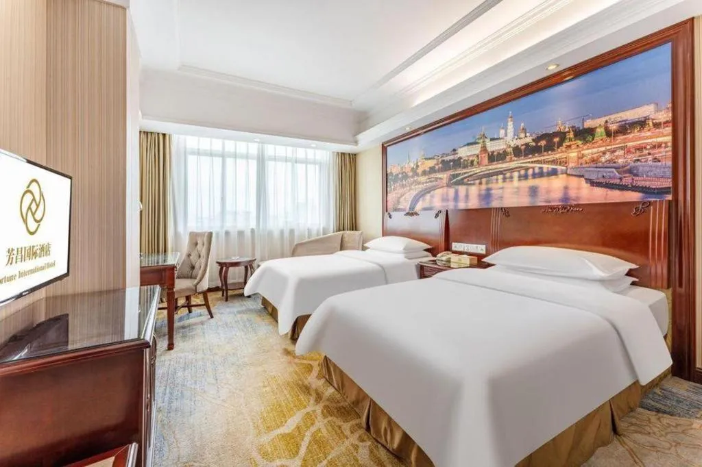 Bed in Vienna International Hotel Guangzhou Tianhe Olympic Stadium Dongpu