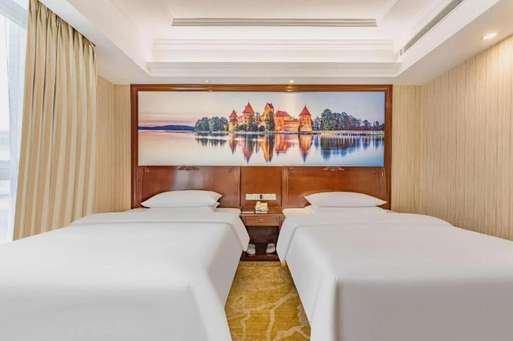 Bed in Vienna International Hotel Guangzhou Tianhe Olympic Stadium Dongpu