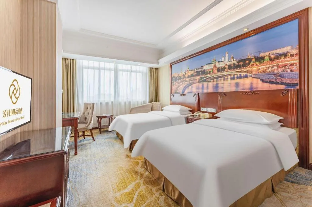 Bed in Vienna International Hotel Guangzhou Tianhe Olympic Stadium Dongpu