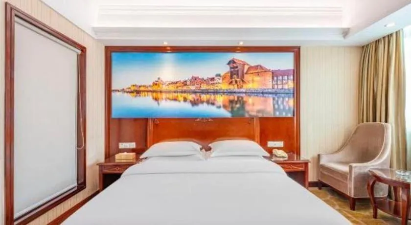 Bed in Vienna International Hotel Guangzhou Tianhe Olympic Stadium Dongpu