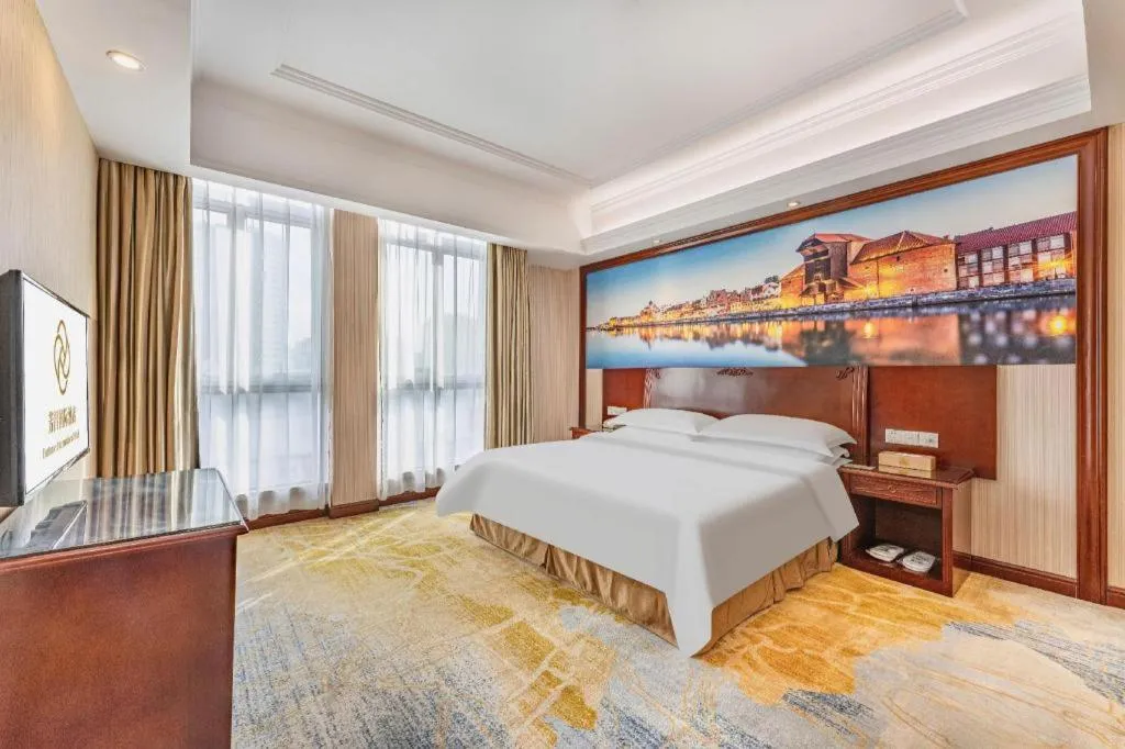Bed in Vienna International Hotel Guangzhou Tianhe Olympic Stadium Dongpu