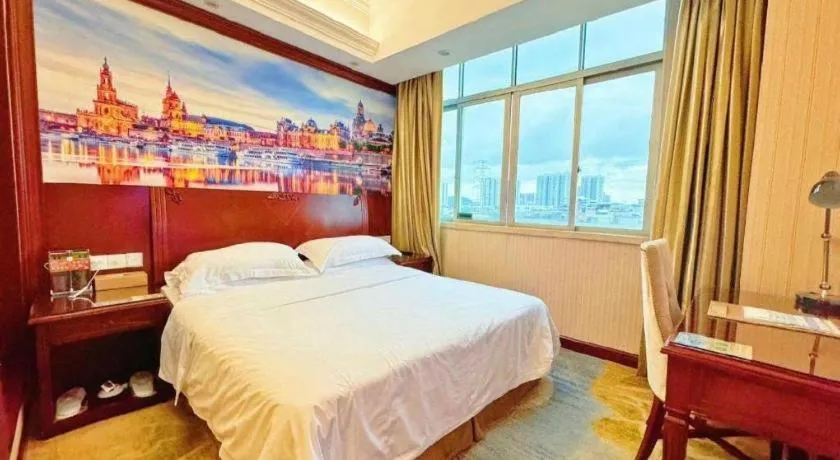 Bed in Vienna International Hotel Guangzhou Tianhe Olympic Stadium Dongpu
