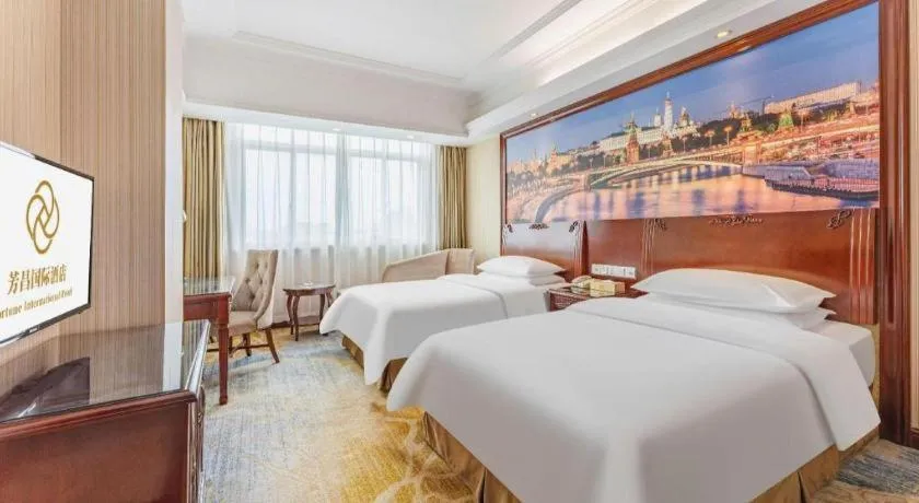 Bed in Vienna International Hotel Guangzhou Tianhe Olympic Stadium Dongpu