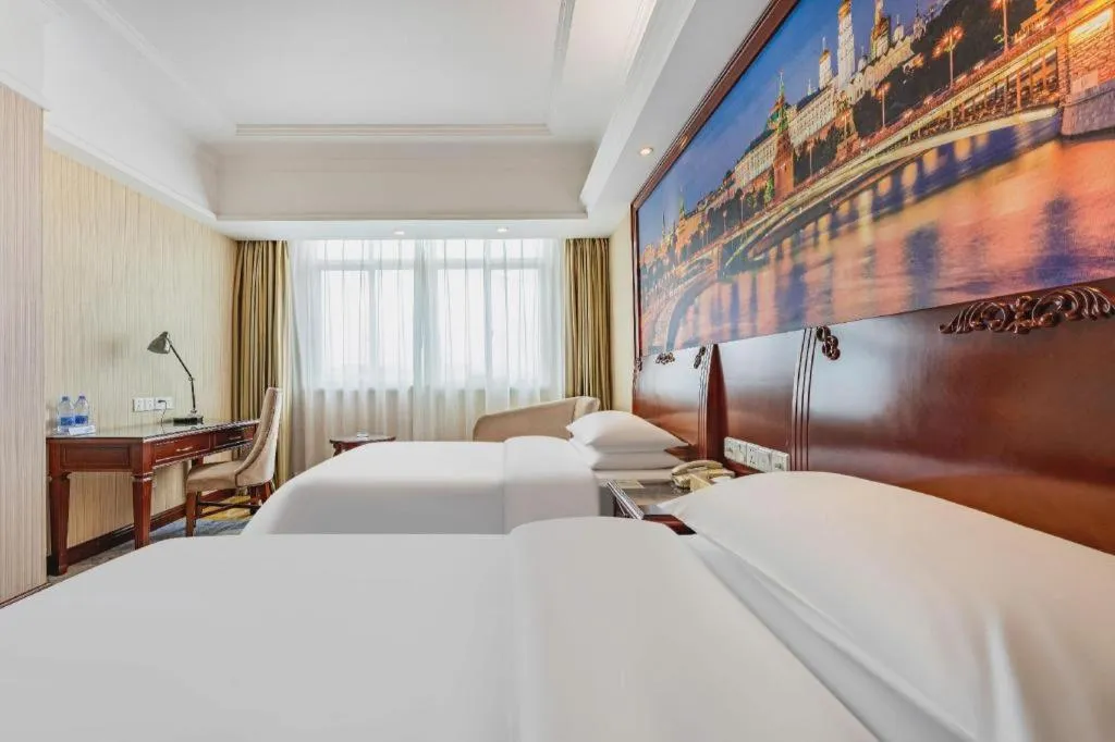 Bed in Vienna International Hotel Guangzhou Tianhe Olympic Stadium Dongpu