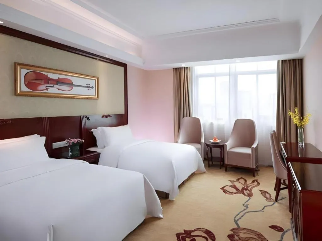 Bed in Vienna International Hotel Guangzhou Tianhe Olympic Stadium Dongpu