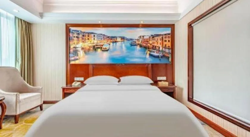 Bed in Vienna International Hotel Guangzhou Tianhe Olympic Stadium Dongpu