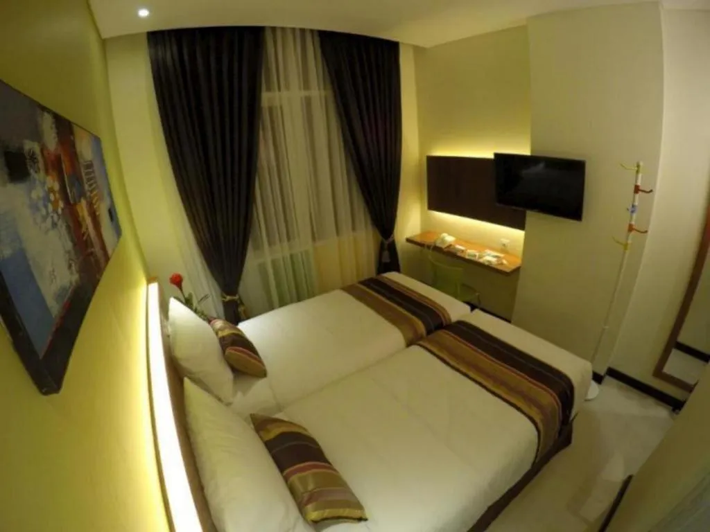 Bed in Biz Boulevard Hotel