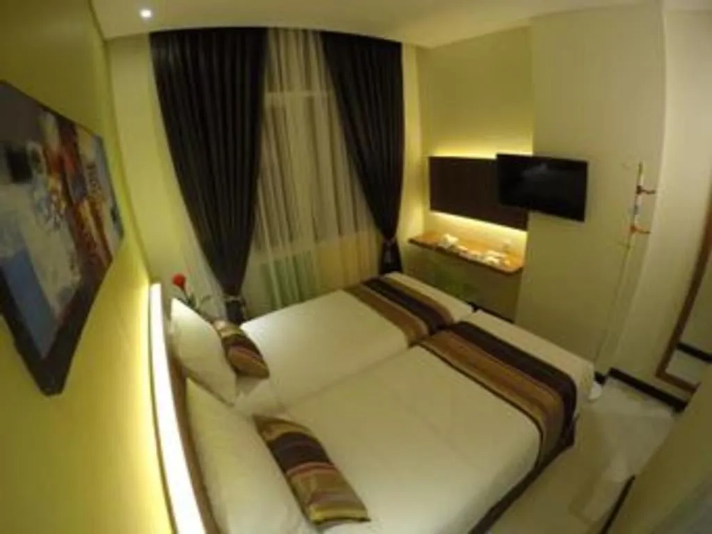 Bed in Biz Boulevard Hotel