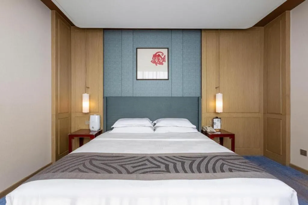 Bed in Bliss International Hotel Weihai