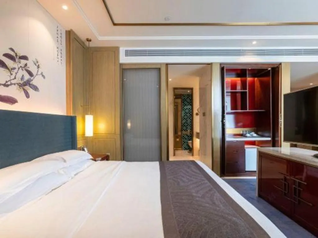 Bed in Bliss International Hotel Weihai