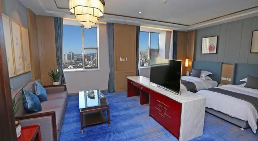 Bed in Bliss International Hotel Weihai