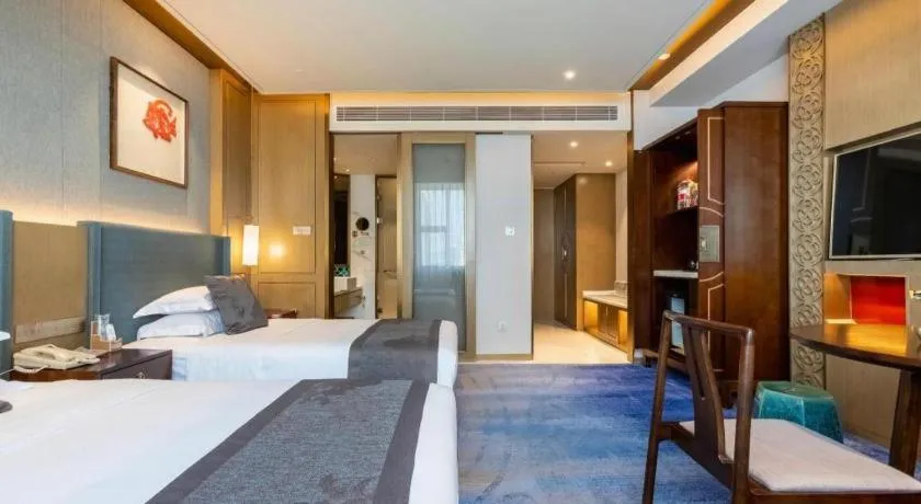 Bed in Bliss International Hotel Weihai