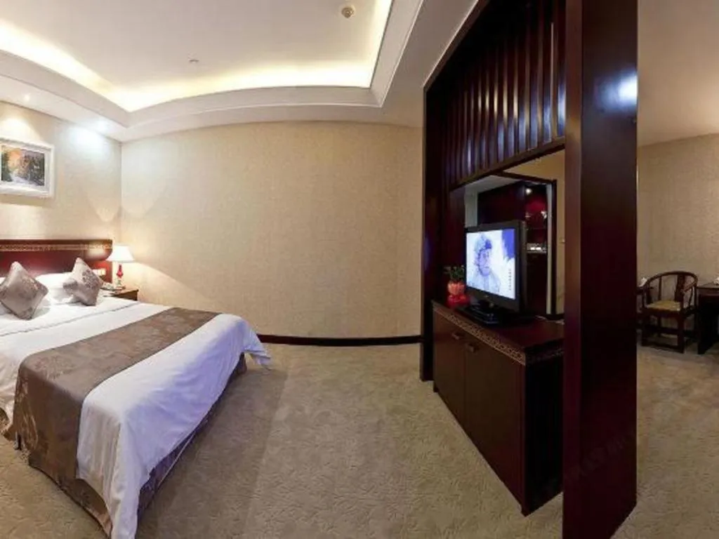 Bed in Bliss International Hotel Weihai