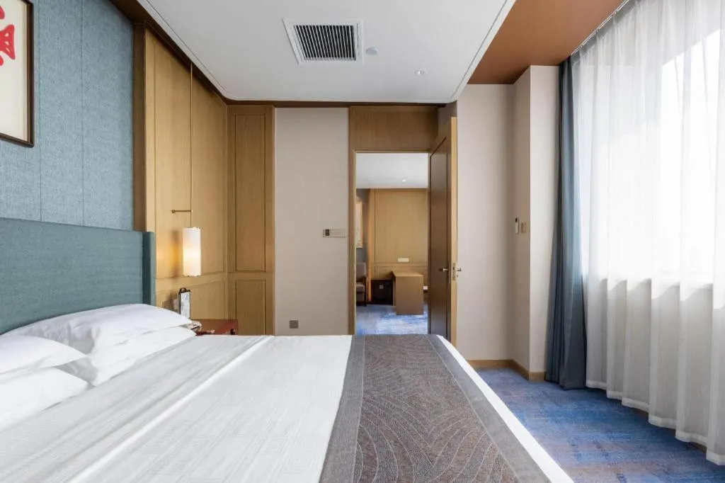 Bed in Bliss International Hotel Weihai