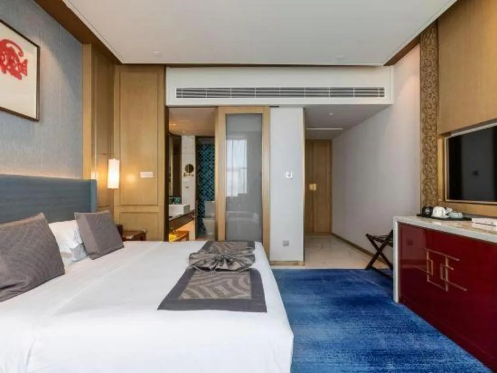 Bed in Bliss International Hotel Weihai