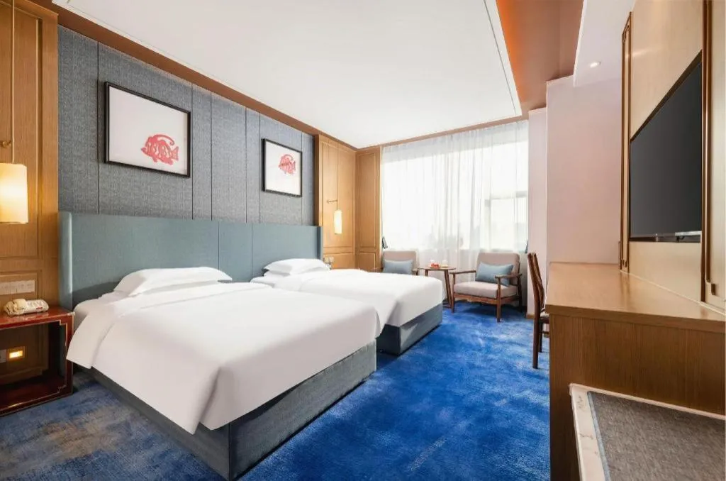 Bed in Bliss International Hotel Weihai