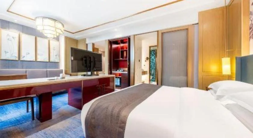 Bed in Bliss International Hotel Weihai