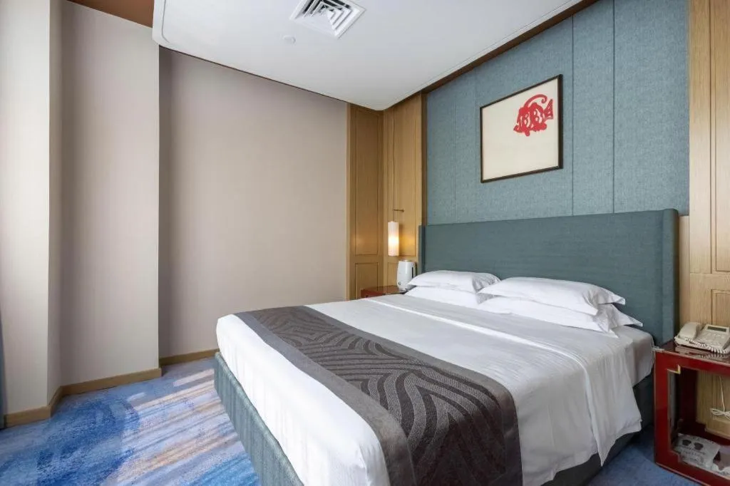 Bed in Bliss International Hotel Weihai