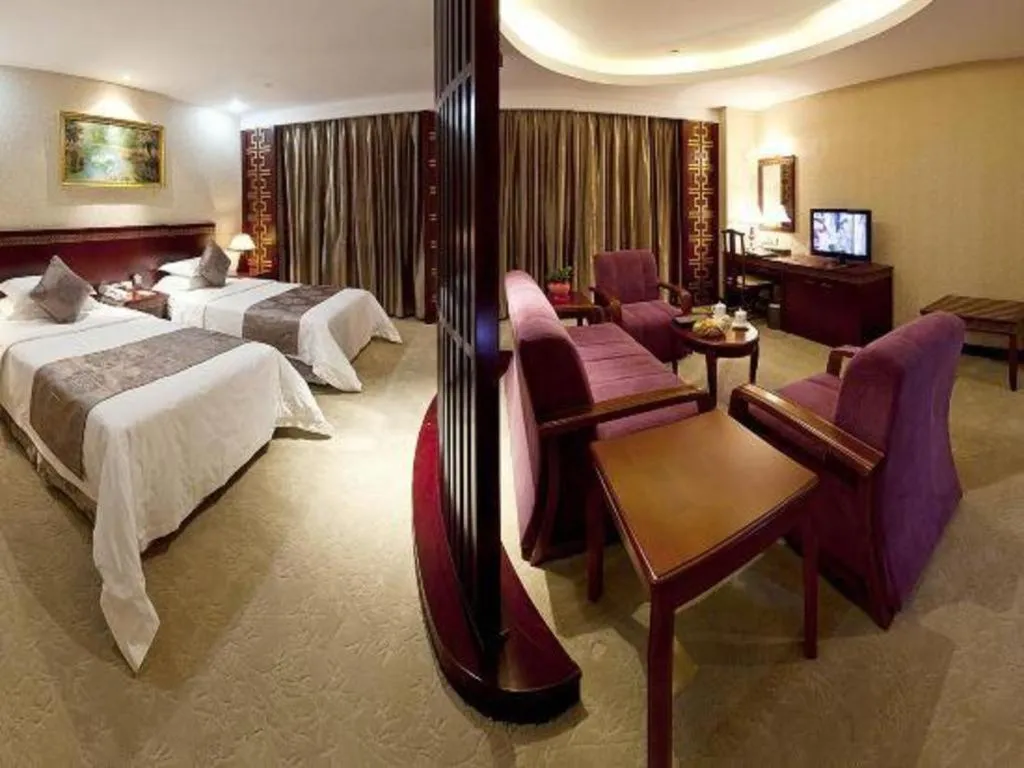 Bed in Bliss International Hotel Weihai