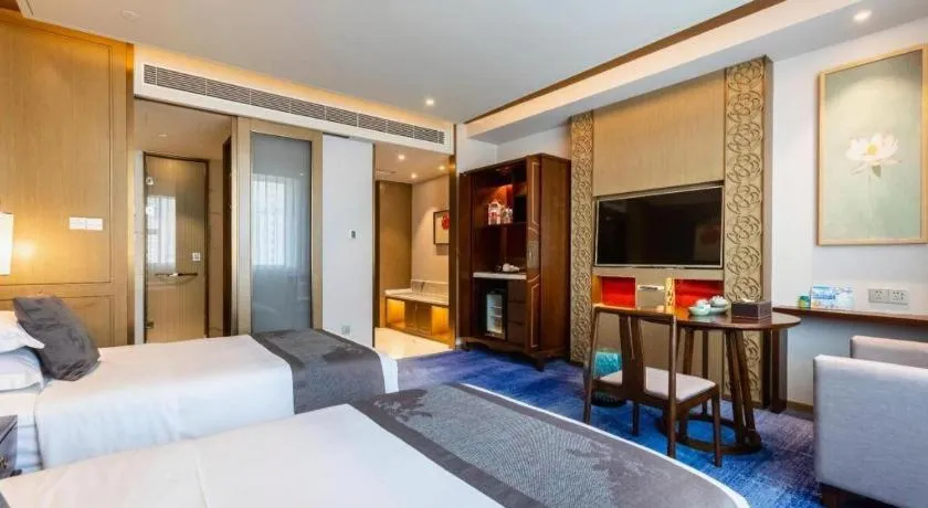 Bed in Bliss International Hotel Weihai