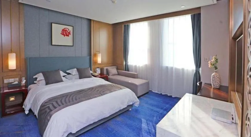 Bed in Bliss International Hotel Weihai