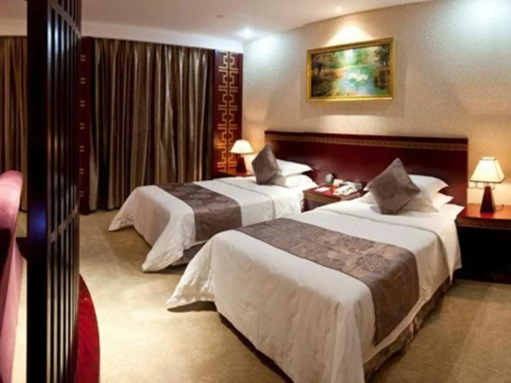 Bed in Bliss International Hotel Weihai