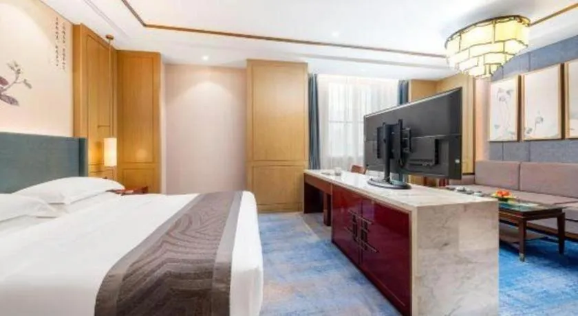 Bed in Bliss International Hotel Weihai