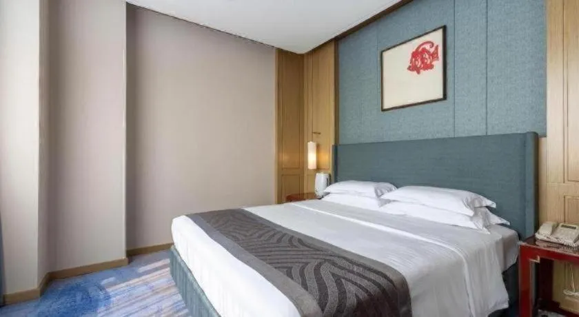 Bed in Bliss International Hotel Weihai