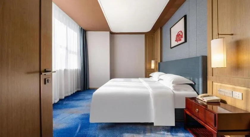 Bed in Bliss International Hotel Weihai