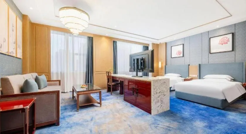 Bed in Bliss International Hotel Weihai
