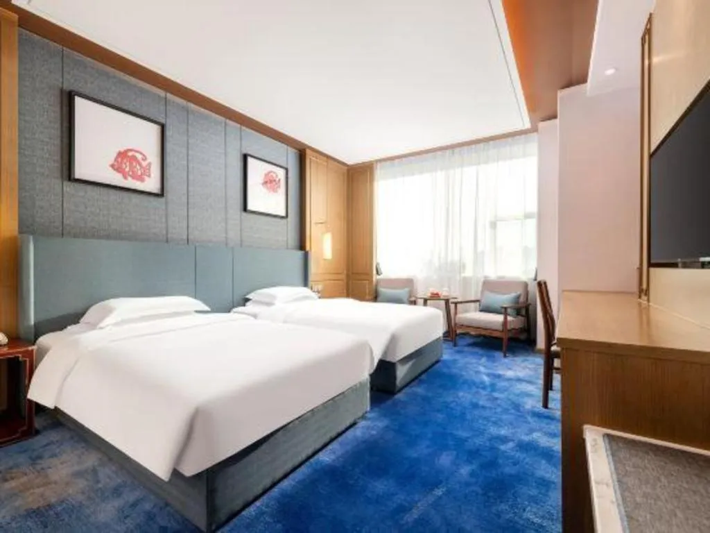 Bed in Bliss International Hotel Weihai