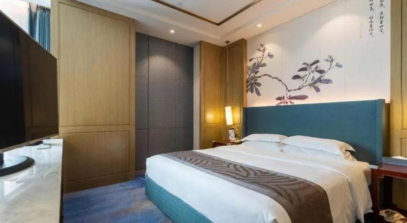 Bed in Bliss International Hotel Weihai